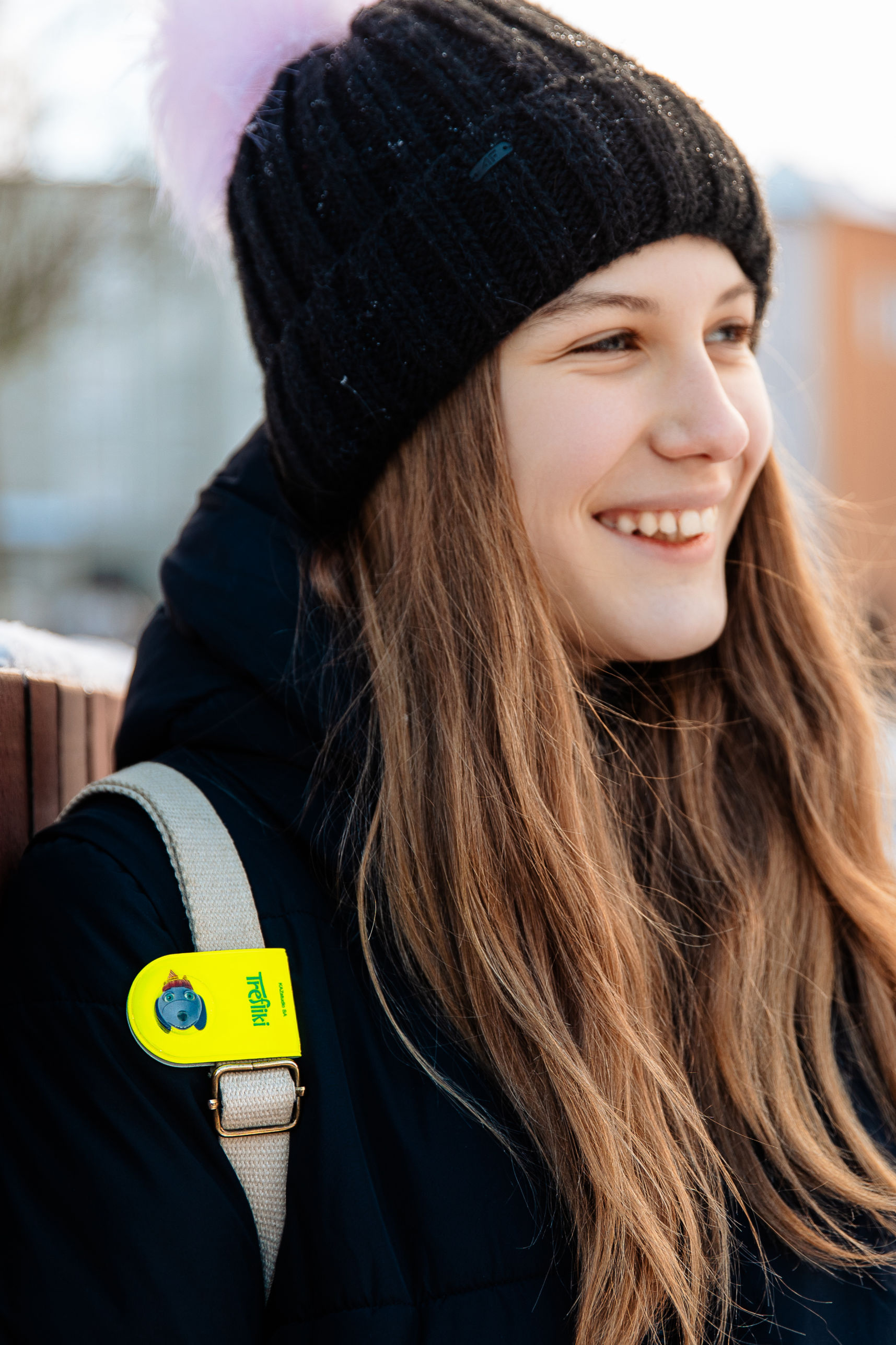 Girl with a reflective yellow magnet clip